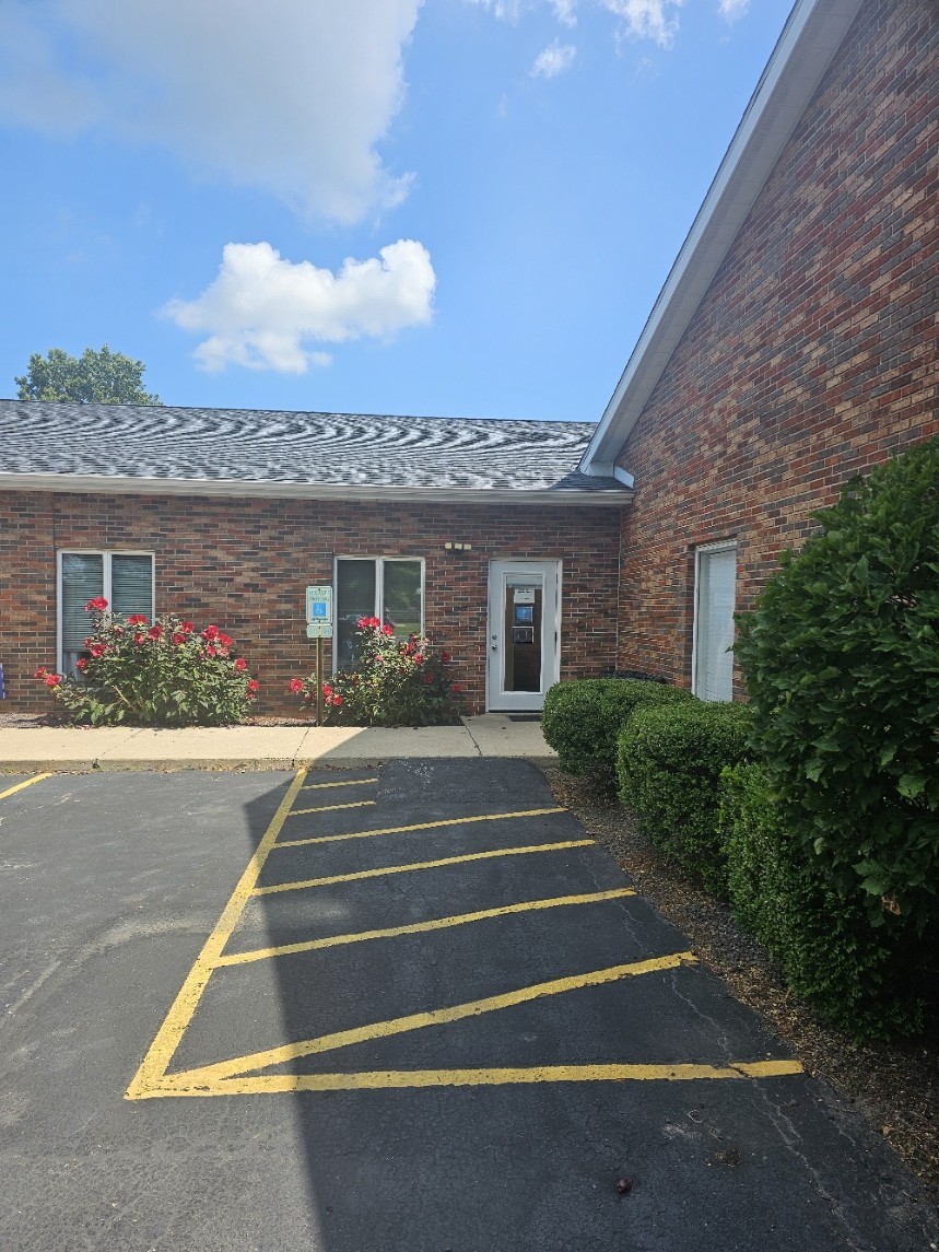 Exterior of the brick multi-suite commercial building at 917 Clocktower Dr, Springfield, IL