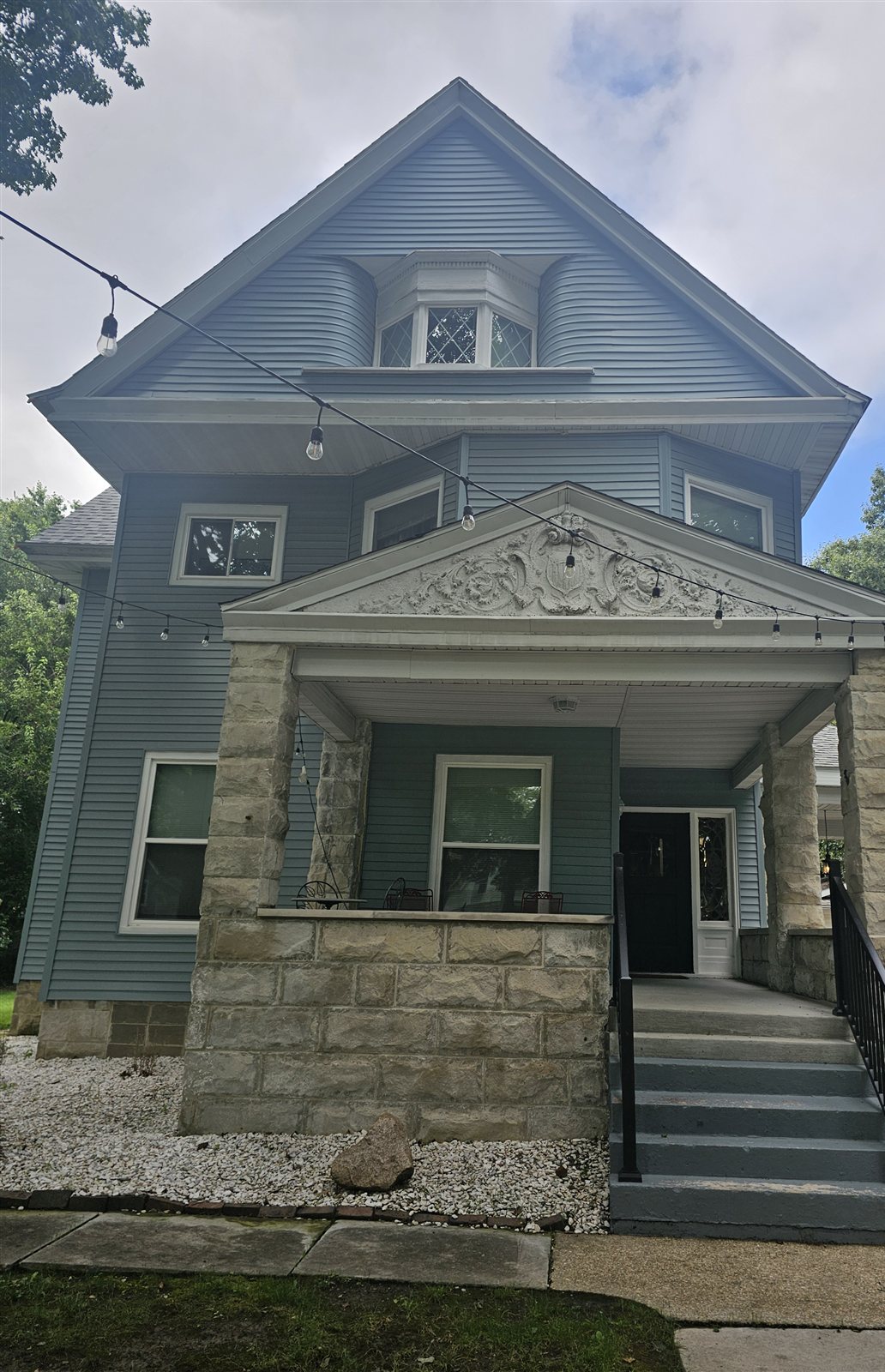 The blue Victorian house at 157 N Douglas, Springfield, IL, managed by Golden Rule Holdings